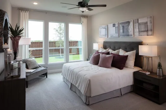 a bedroom with a bed and a cabinets