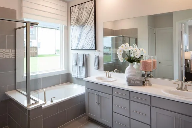 a bathroom with a granite countertop sink a toilet and shower