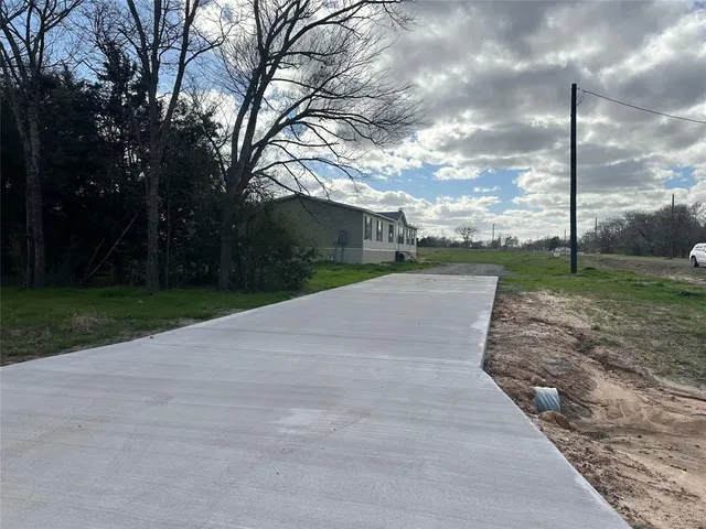 a view of a terrace with yard