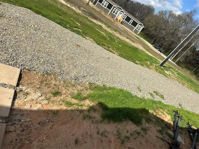 a view of empty room with a fireplace