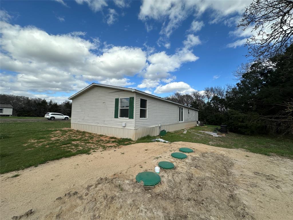 230 Largo Street Bonham, TX 75418 - Photo 5 of 34 a backyard of a house