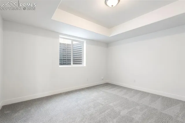 a bathroom with a granite countertop sink a large mirror and a shower