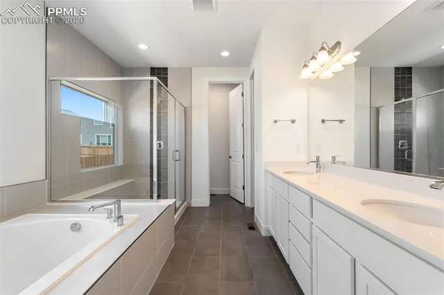 a white toilet sitting in a bathroom next to a sink