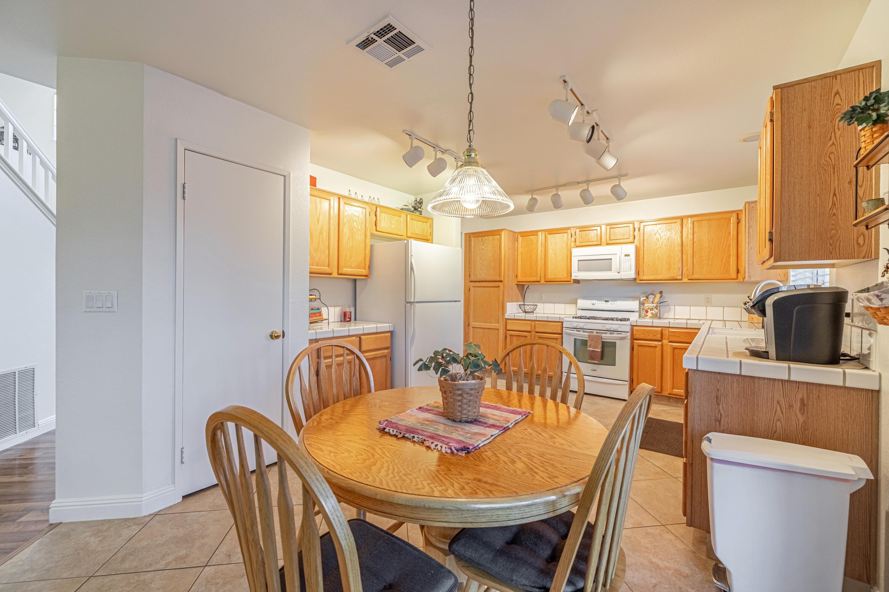 44220 Encanto Way Lancaster, CA 93536 - Photo 11 of 45 a dining room with furniture and window