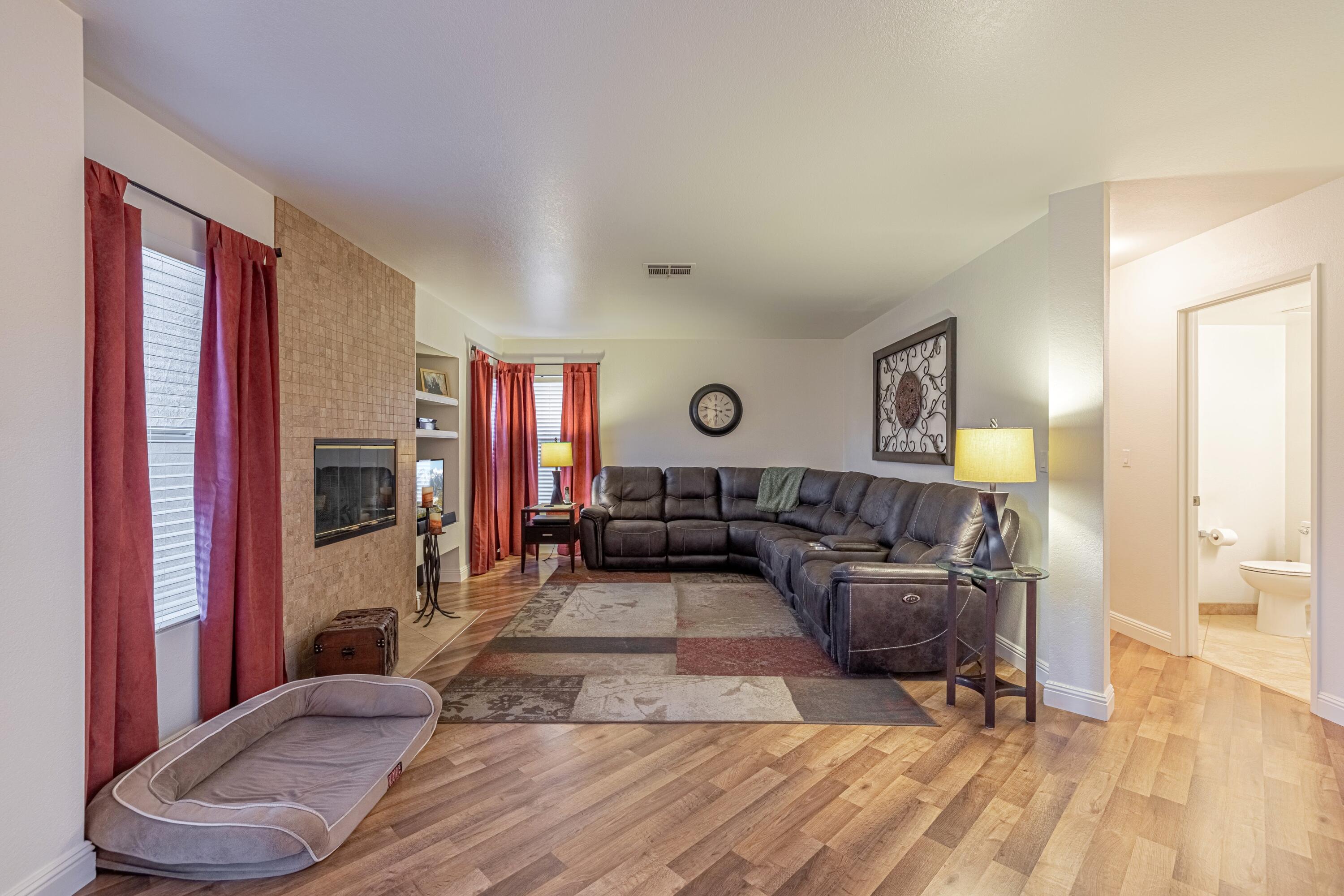 44220 Encanto Way Lancaster, CA 93536 - Photo 12 of 45 a living room with furniture and a fireplace