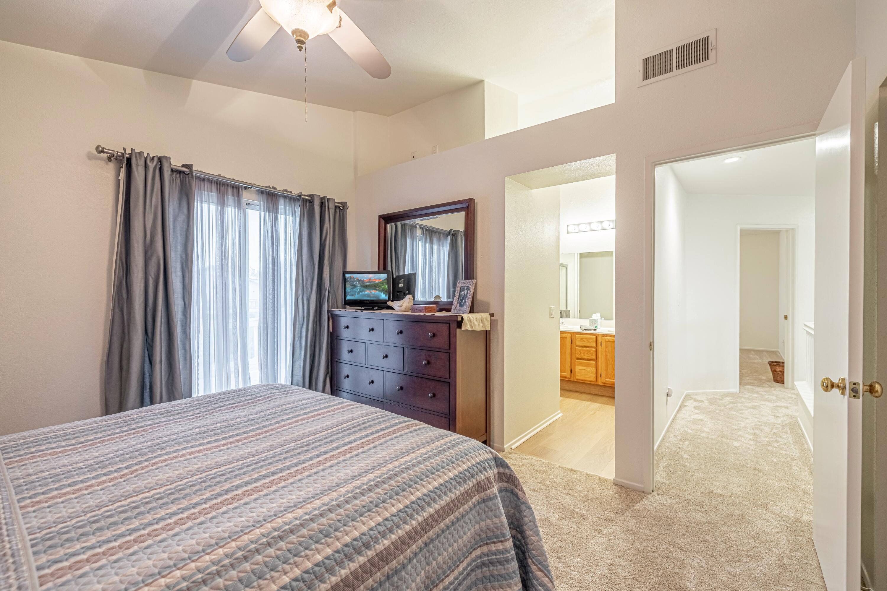44220 Encanto Way Lancaster, CA 93536 - Photo 20 of 45 a bedroom with a bed and a dresser