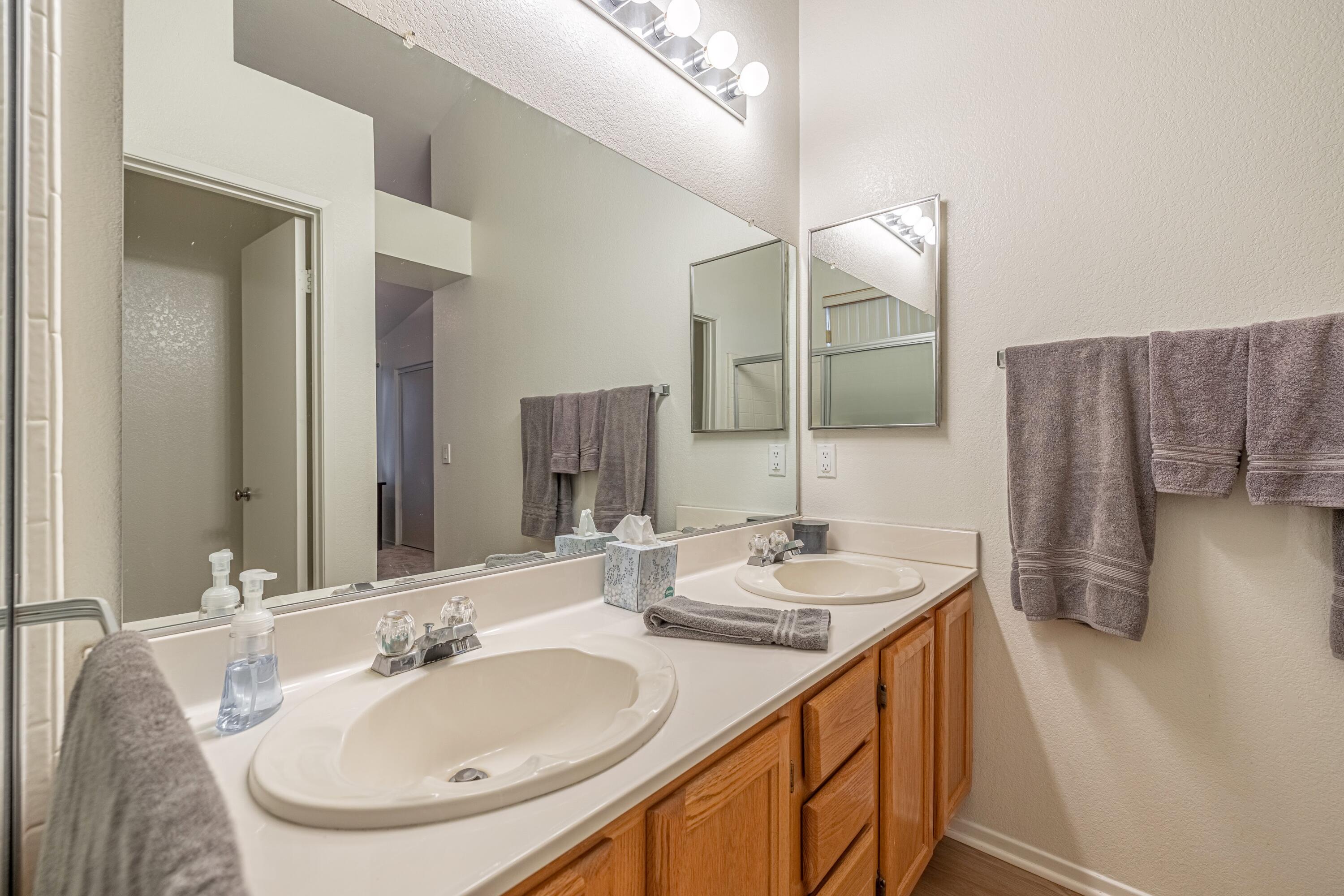 44220 Encanto Way Lancaster, CA 93536 - Photo 22 of 45 a bathroom with a sink and a mirror