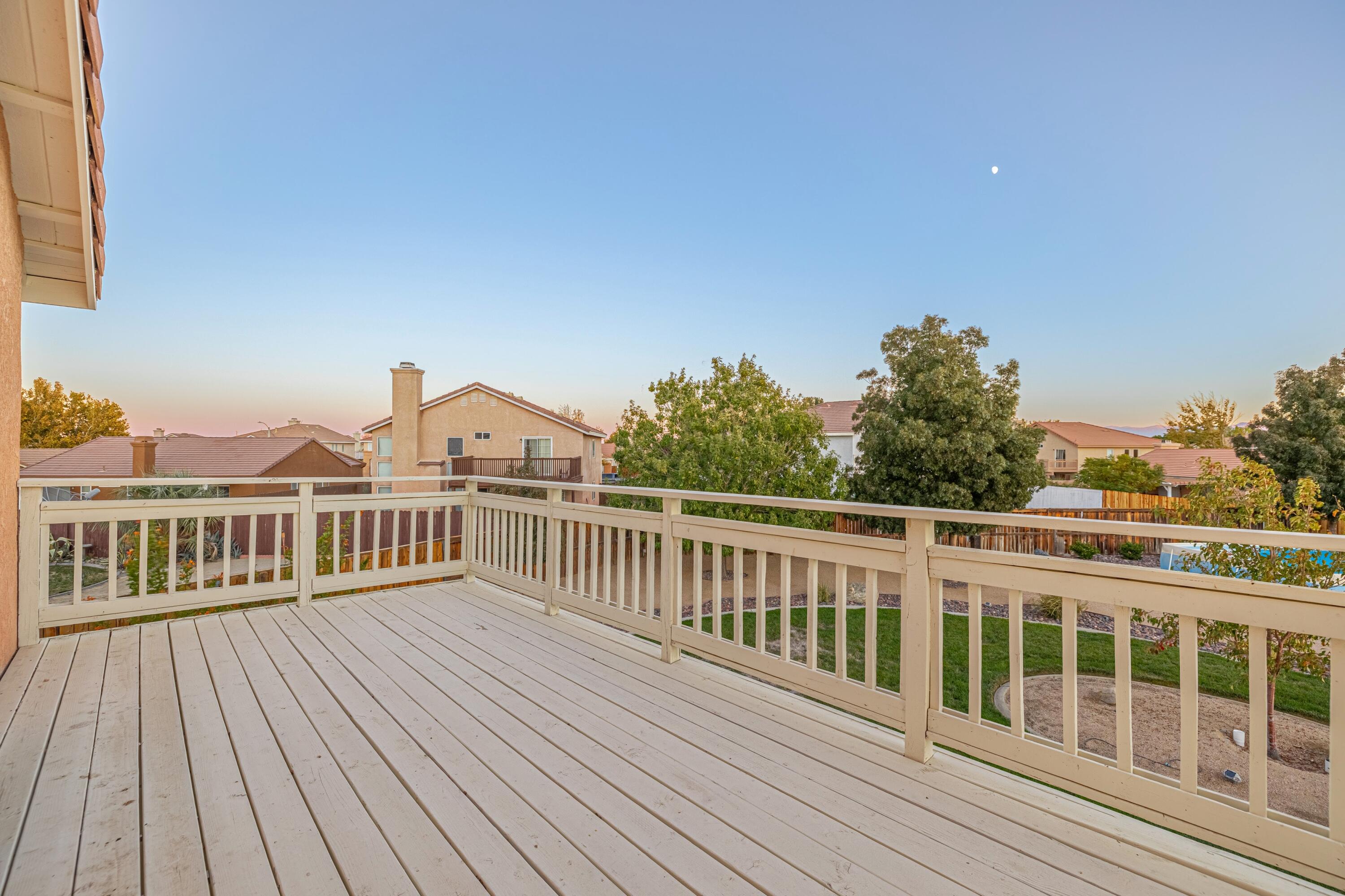 44220 Encanto Way Lancaster, CA 93536 - Photo 23 of 45 a view of a wooden deck and city view