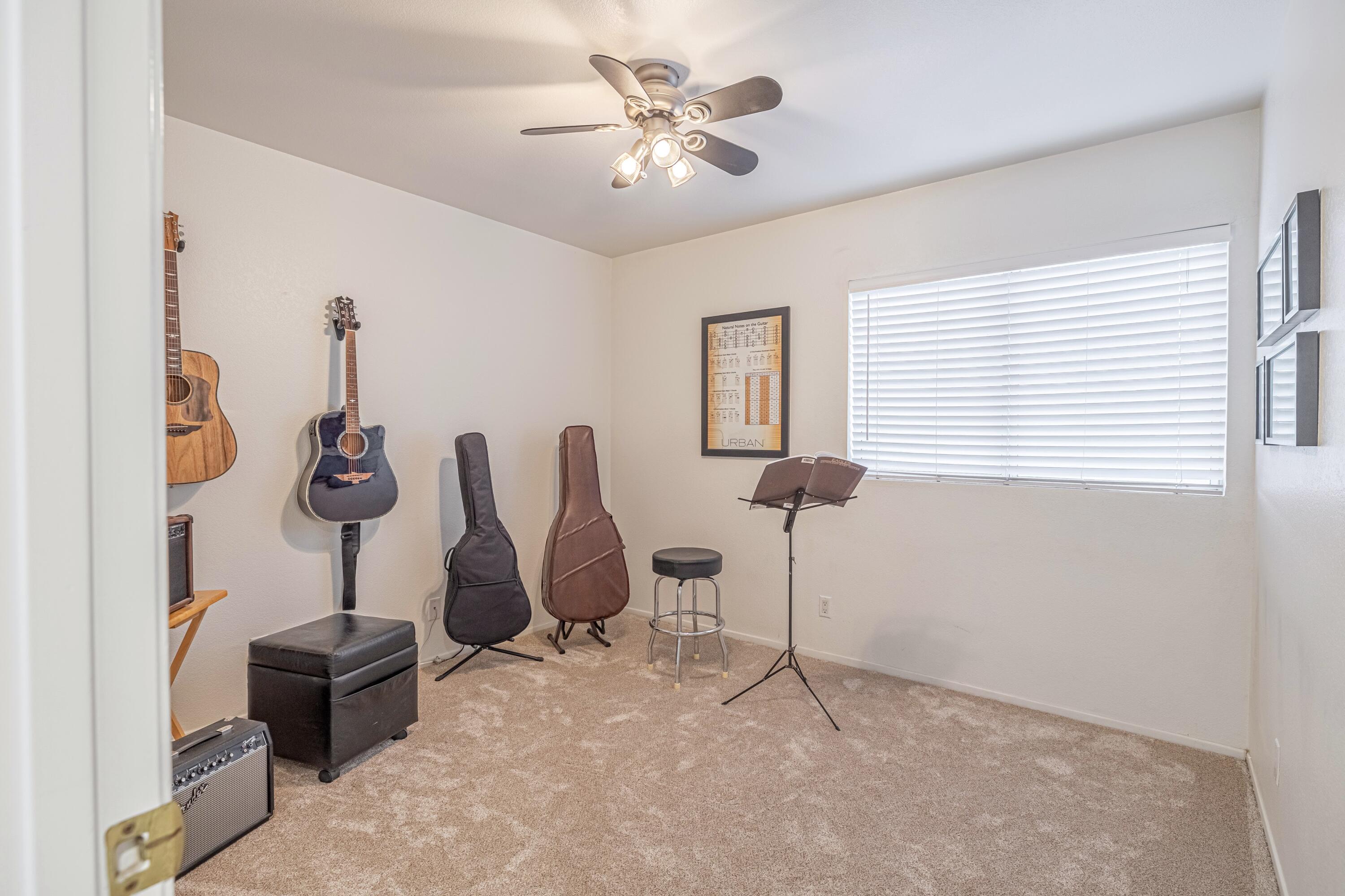 44220 Encanto Way Lancaster, CA 93536 - Photo 27 of 45 a bedroom with furniture and a chandelier fan