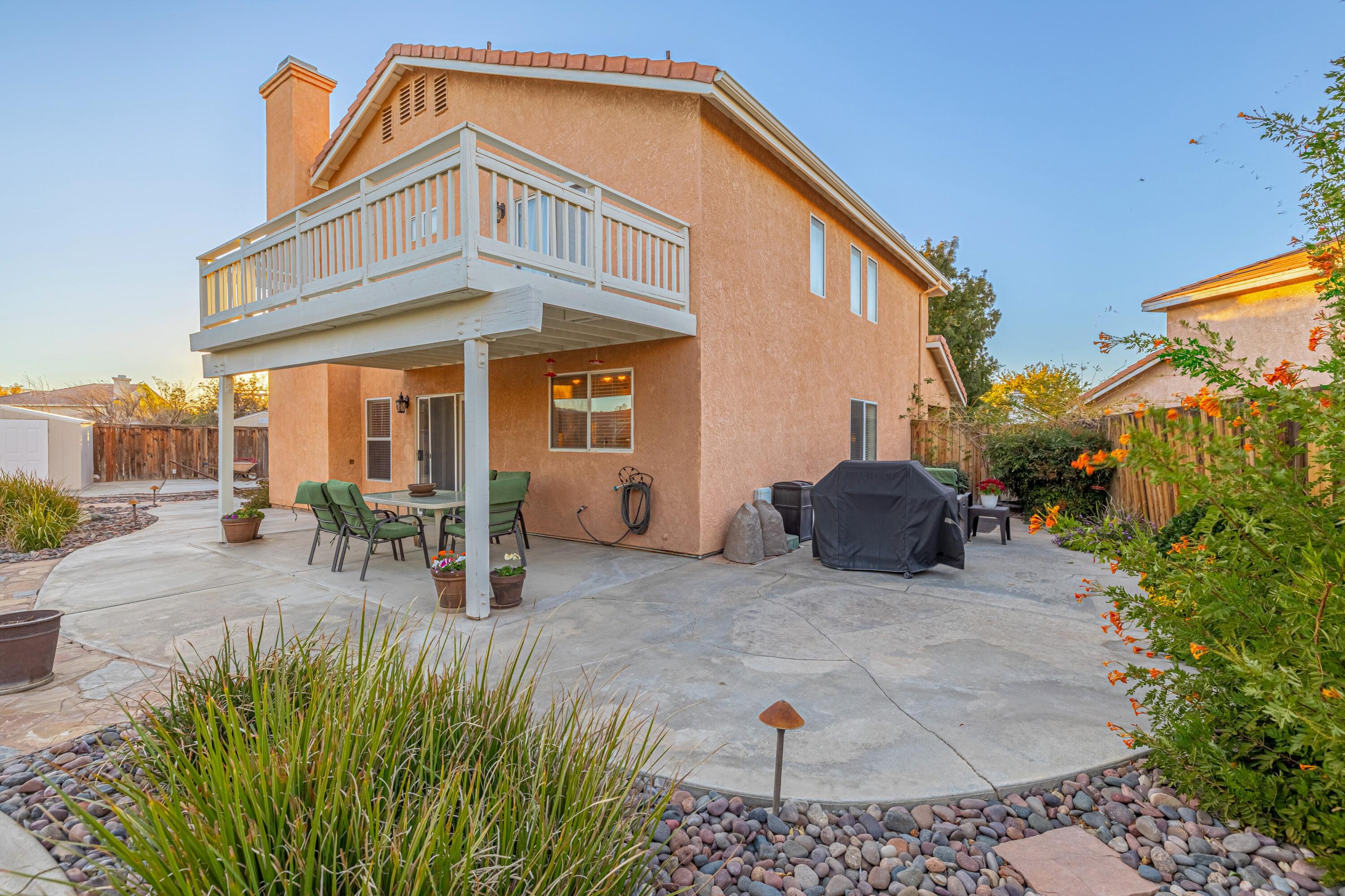 44220 Encanto Way Lancaster, CA 93536 - Photo 35 of 45 a view of a house with backyard and sitting area