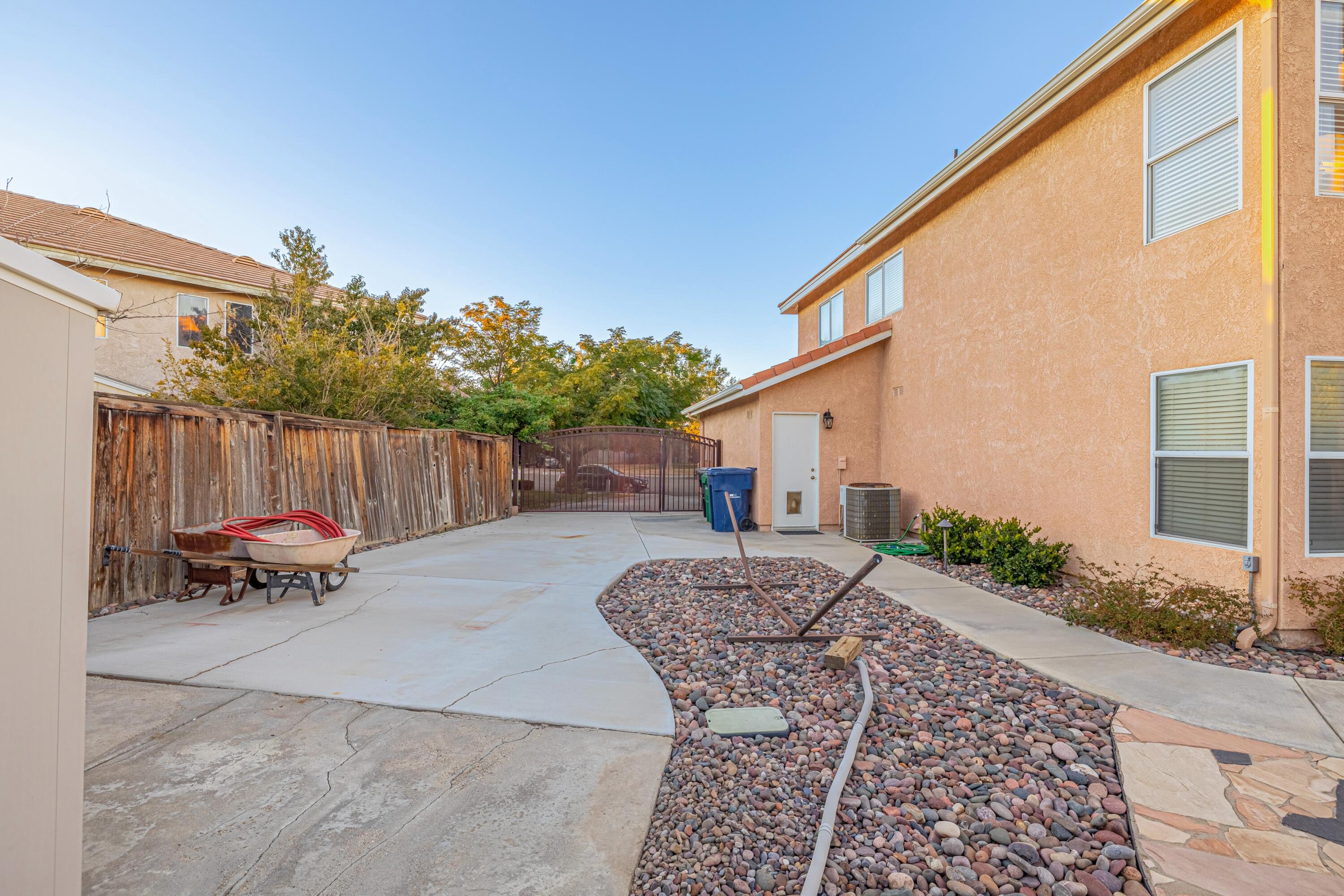 44220 Encanto Way Lancaster, CA 93536 - Photo 39 of 45 a backyard of a house with table and chairs