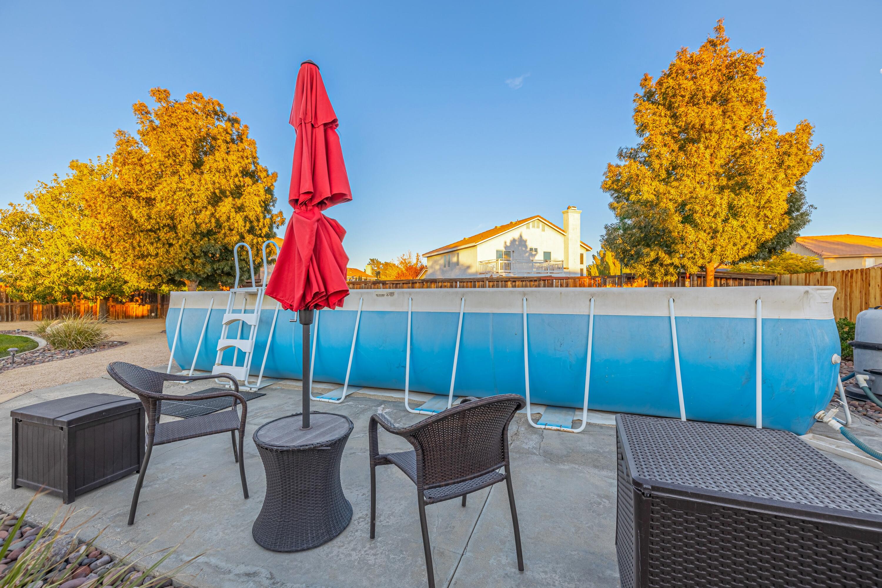 44220 Encanto Way Lancaster, CA 93536 - Photo 42 of 45 a backyard of a house with table and chairs