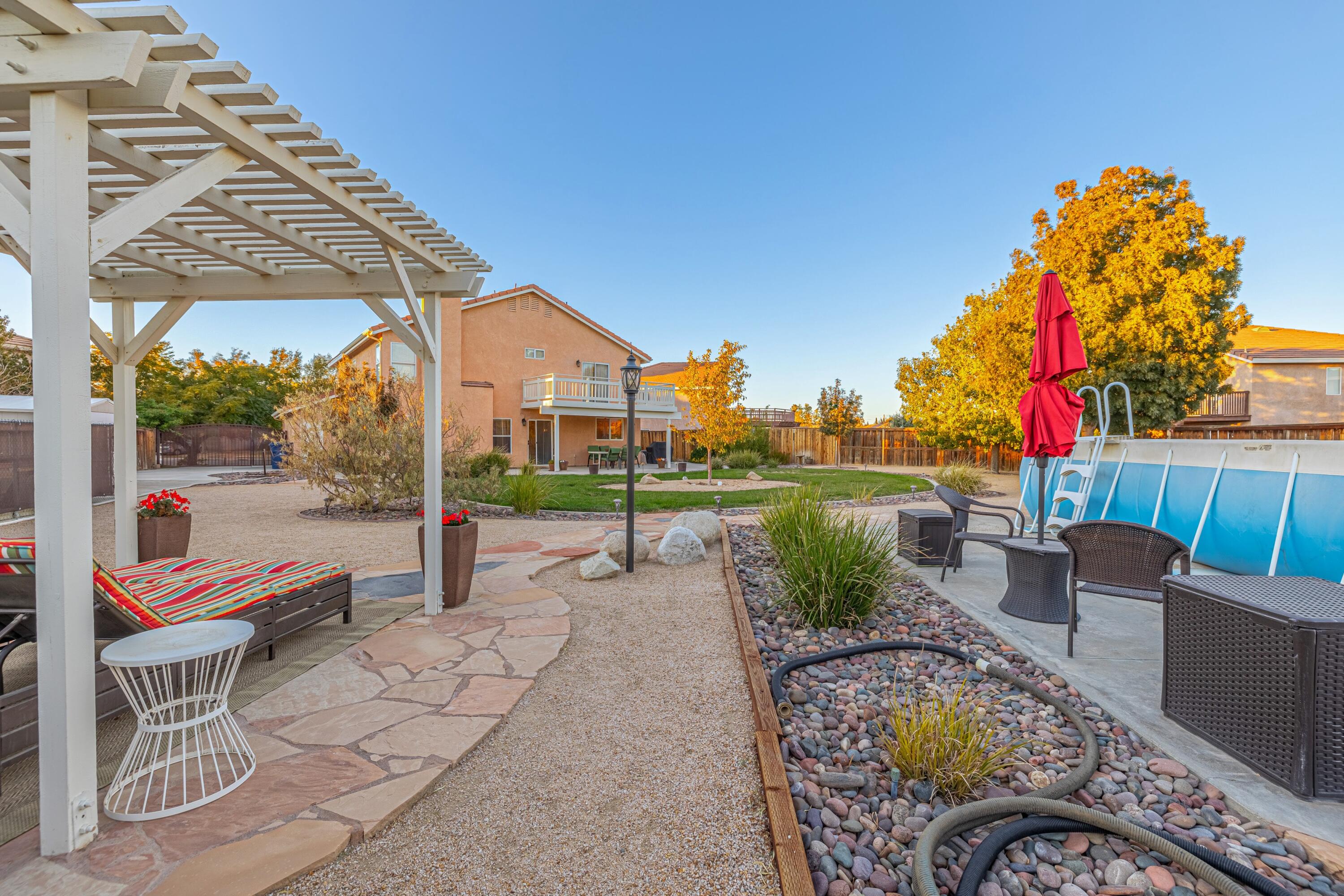 44220 Encanto Way Lancaster, CA 93536 - Photo 45 of 45 a patio with table and chairs
