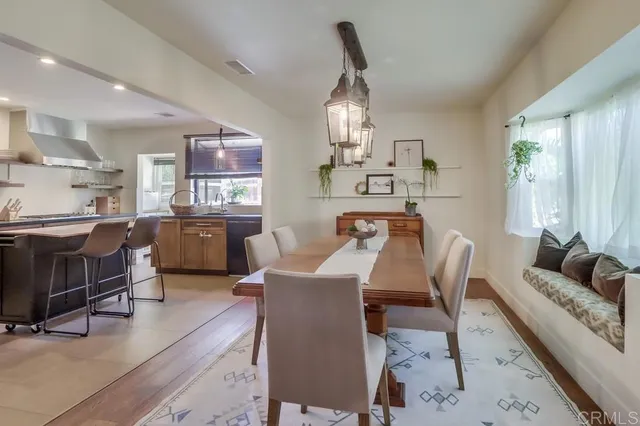 a kitchen with granite countertop a sink a counter top space appliances and cabinets