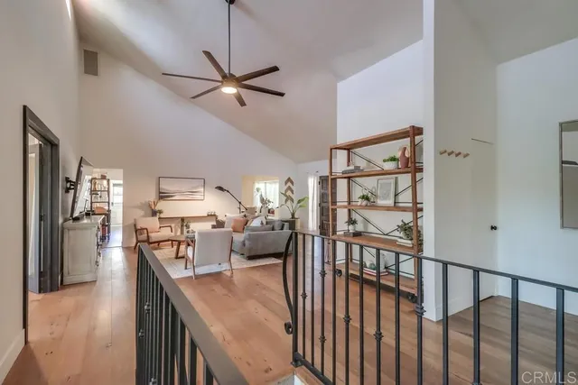 a living room with furniture a window and a table