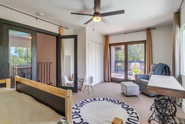 a bedroom with a bed and a mirror