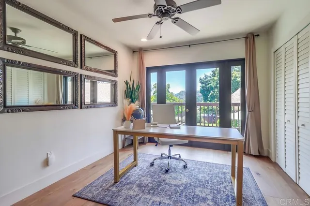 a bedroom with a large bed and a flat screen tv