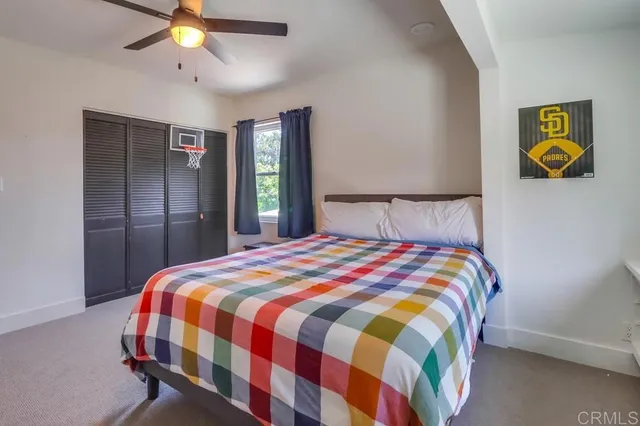 a view of a house with swimming pool and sitting area