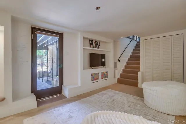 a view of a backyard with sitting area