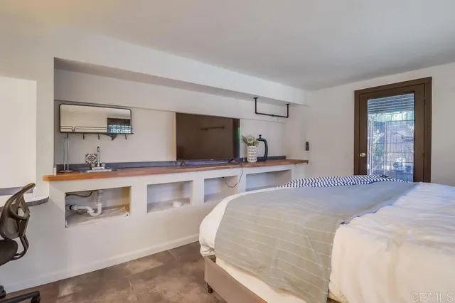 a view of backyard with swimming pool and patio