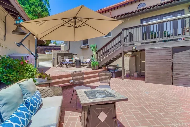 a living room with furniture and a book shelf