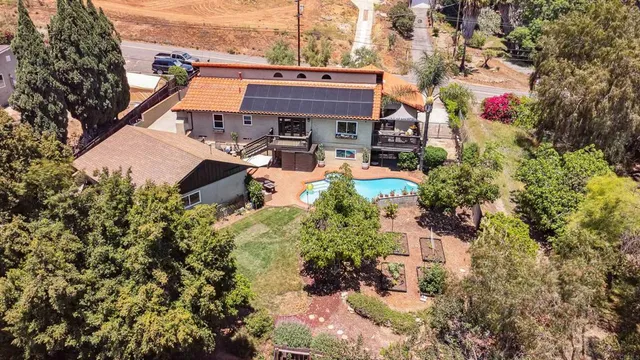 a living room with furniture flat screen tv and wooden floor