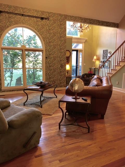 6306 Gum Station Road Springfield, TN 37172 - Photo 4 of 26 Soaring ceilings and hardwood floors create an impressive living room.