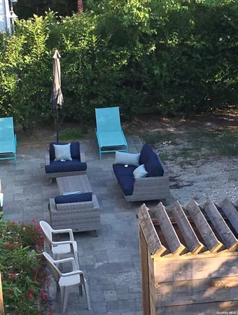 a view of backyard with seating space