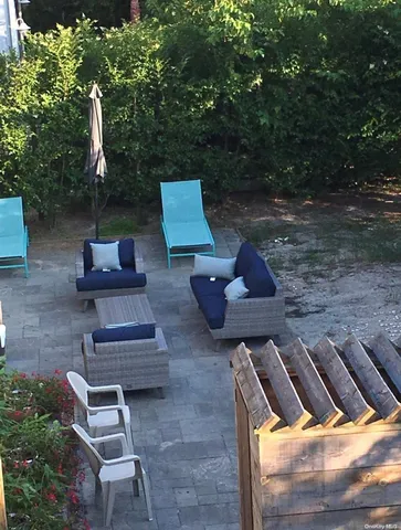 a view of backyard with seating space