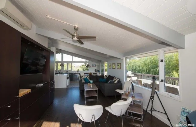 a view of a dining room with furniture window and outside view