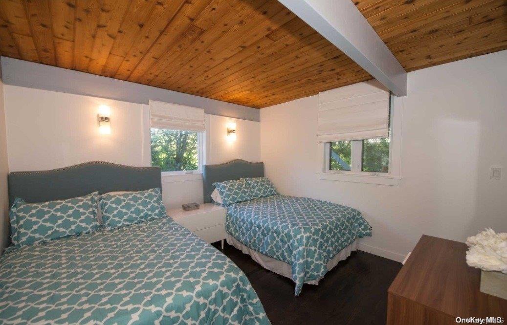 170 Clipper Ocean Beach, NY 11770 - Photo 7 of 11 a bedroom with a bed and window