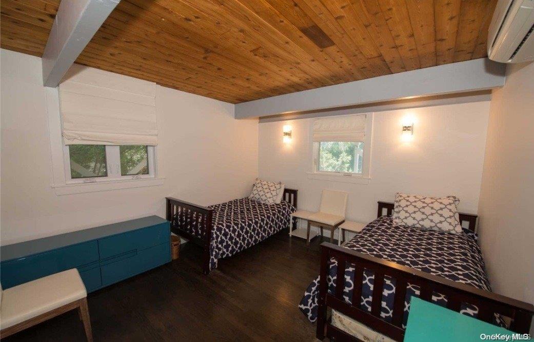 170 Clipper Ocean Beach, NY 11770 - Photo 9 of 11 a room with chairs stairs and a window