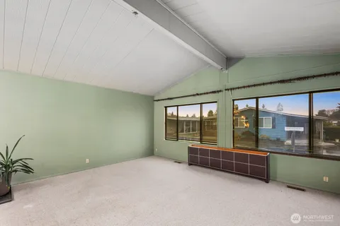 a view of a hallway with a kitchen