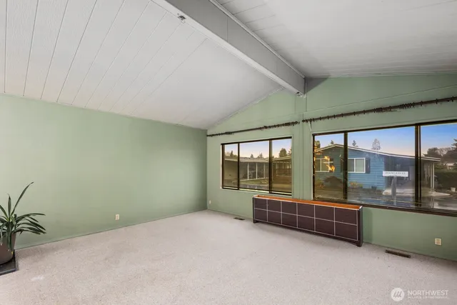a view of a hallway with a kitchen