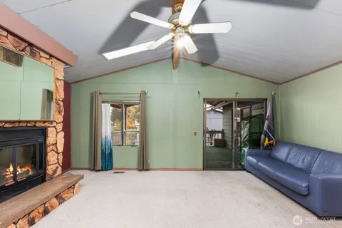 a kitchen with a sink window and cabinets