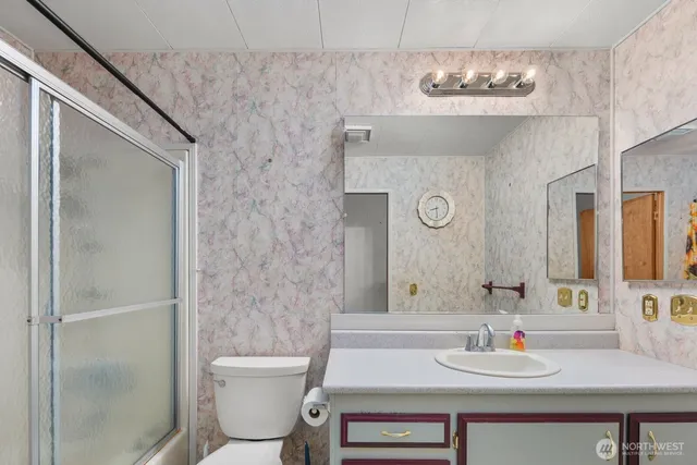 a bathroom with a shower and a sink