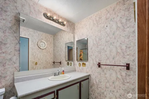 a bathroom with a sink and a mirror