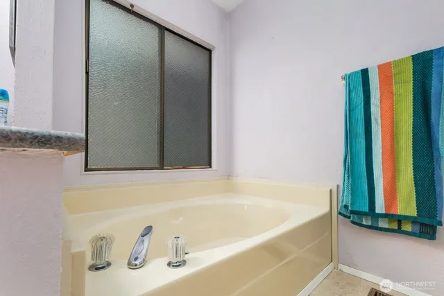 a view of a porch with furniture and garden