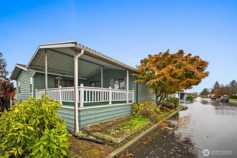 an aerial view of a house with a big yard