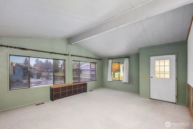 a view of a hallway with a window