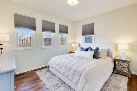 a bedroom with a large bed and a tv