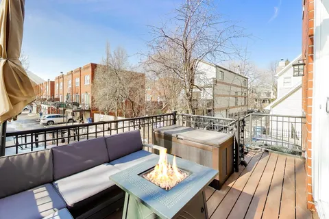 a view of a balcony with wooden floor
