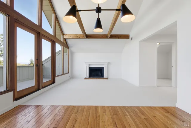 a view of hallway with wooden floor
