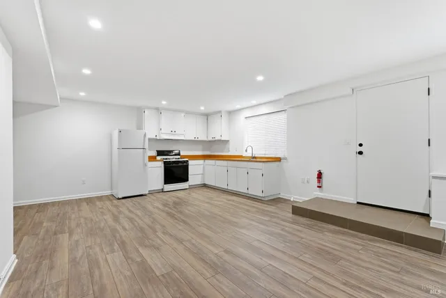 an aerial view of a house with outdoor space and street view