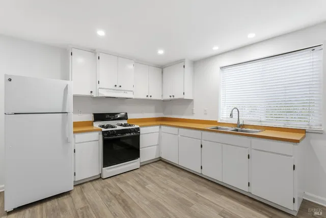 an aerial view of a house with a yard and garden