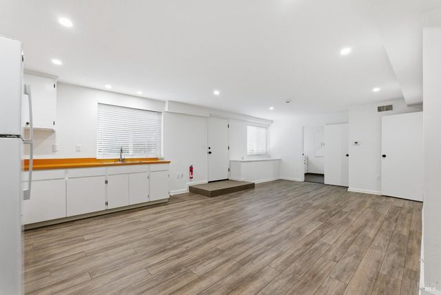 an aerial view of houses with trees