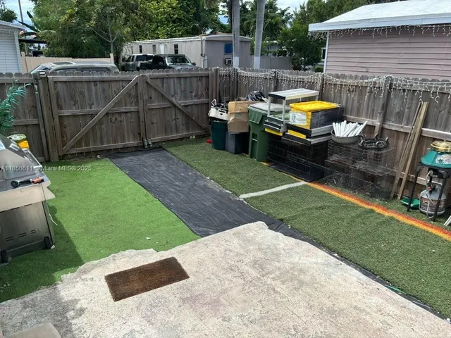 a view of a backyard with a tub