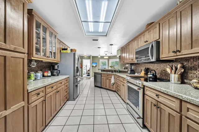 a dining room with furniture and window