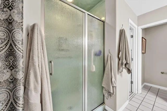 a bedroom with bed and window