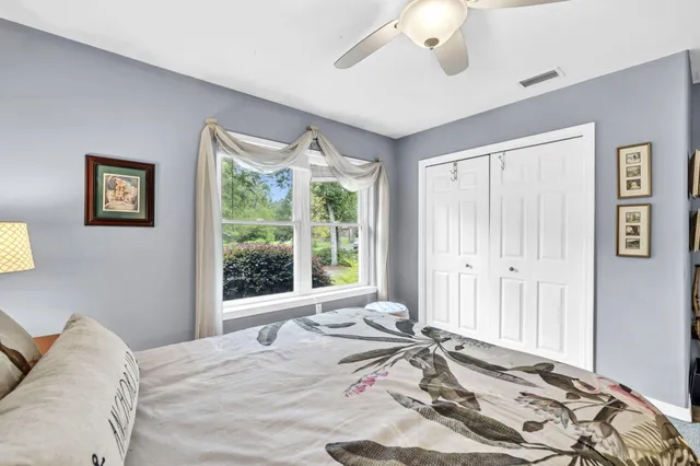 a bathroom with a double vanity sink mirror and shower